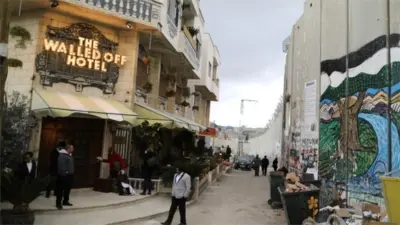 Banksy hotel, The Walled Off, opens in Bethlehem - BBC News