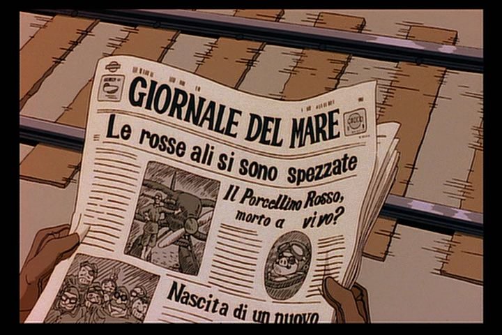 ポルコが読んでいる新聞の見出し。「真紅の翼折れる」、「ポルチェ