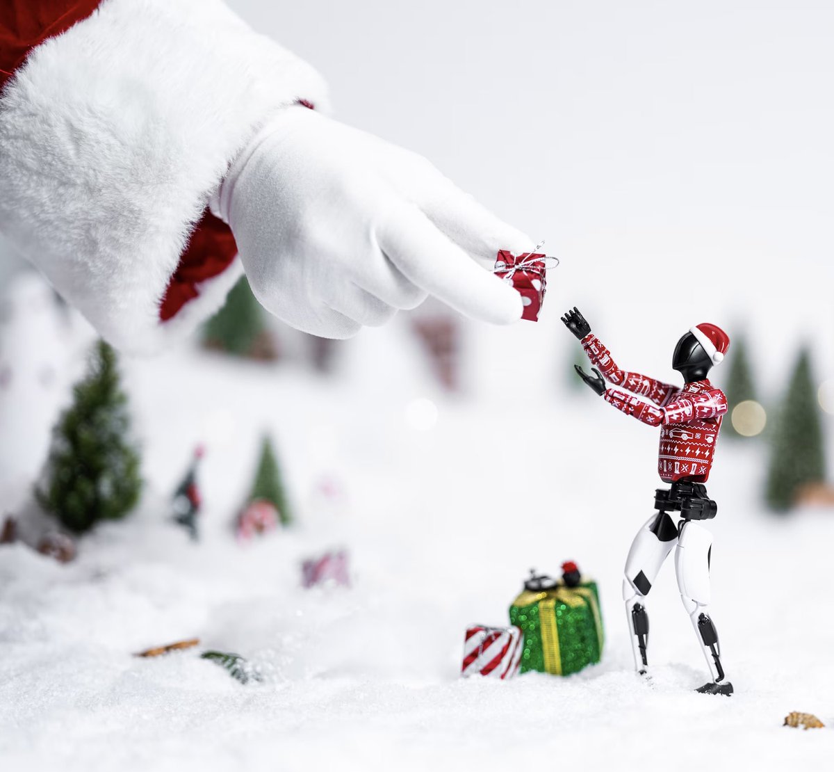 Tesla has released a Holiday Edition Tesla Bot action figure in